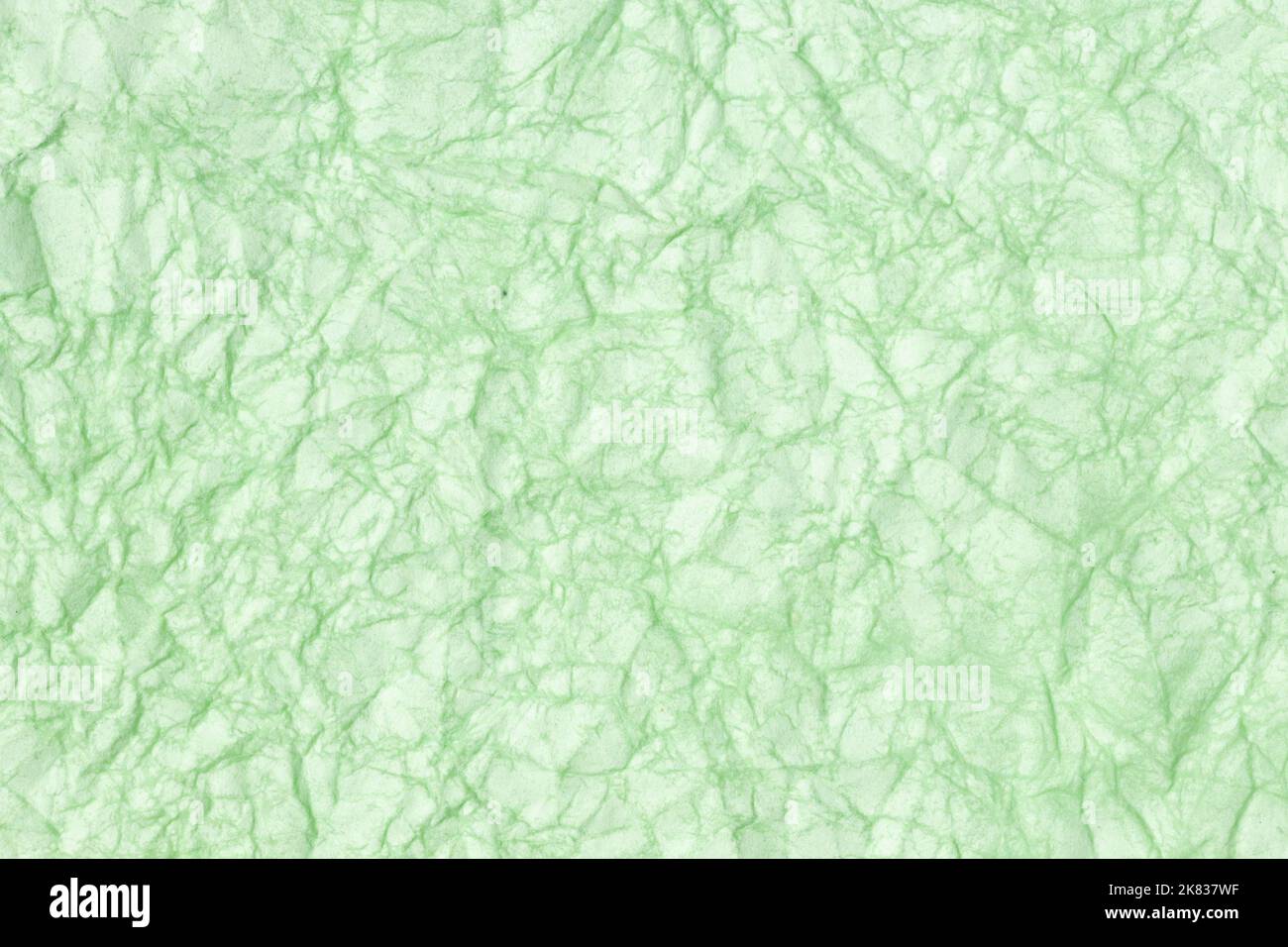 Carta stropicciata trama astratta sfondo. Colore verde. Full frame Foto Stock