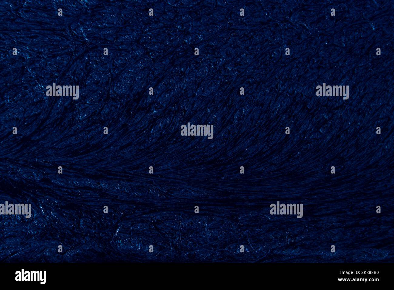 Sfondo di colore blu con texture ondulate di diverse sfumature di blu scuro Foto Stock