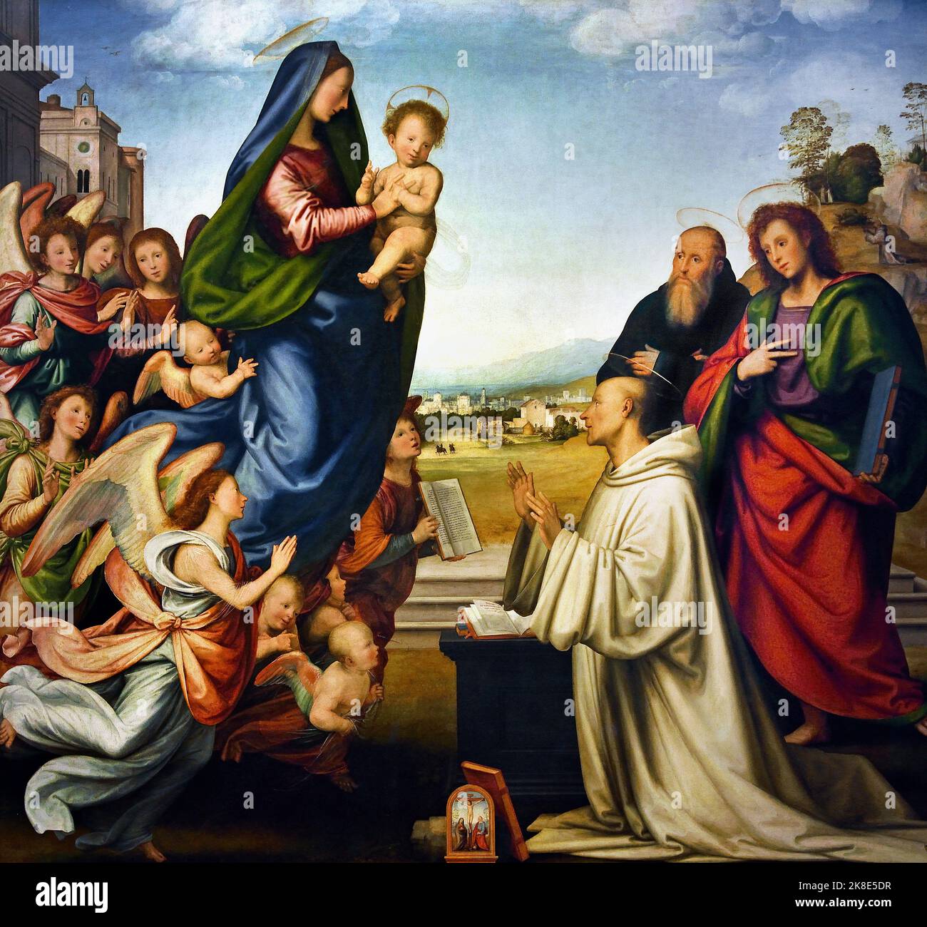 La visione di San Bernardo 1504. Fra Bartolomeo o Bartolommeo 1472 – 1517 ( Bartolommeo di Pagholo - Baccio della porta) pittore italiano rinascimentale di soggetti religiosi. Firenze e Roma. L'apparizione della Vergine a San Bernardo è un dipinto ad olio su legno di fra Bartolomeo, databile tra il 1504 e il 1507. Più articolata, però, è la metà sinistra, quella della Vergine, dove si trovano una serie di angeli che sembrano spingere per far avanzare la Madonna. A destra, invece, la presenza di due santi, Benedetto e Barnaba, bilancia il gruppo di Bernardo. Sullo sfondo c'è un br Foto Stock La visione di San Bernardo 1504. Fra Bartolomeo o Bartolommeo 1472 – 1517 ( Bartolommeo di Pagholo - Baccio della porta) pittore italiano rinascimentale di soggetti religiosi. Firenze e Roma. L'apparizione della Vergine a San Bernardo è un dipinto ad olio su legno di fra Bartolomeo, databile tra il 1504 e il 1507. Più articolata, però, è la metà sinistra, quella della Vergine, dove si trovano una serie di angeli che sembrano spingere per far avanzare la Madonna. A destra, invece, la presenza di due santi, Benedetto e Barnaba, bilancia il gruppo di Bernardo. Sullo sfondo c'è un br Foto Stock