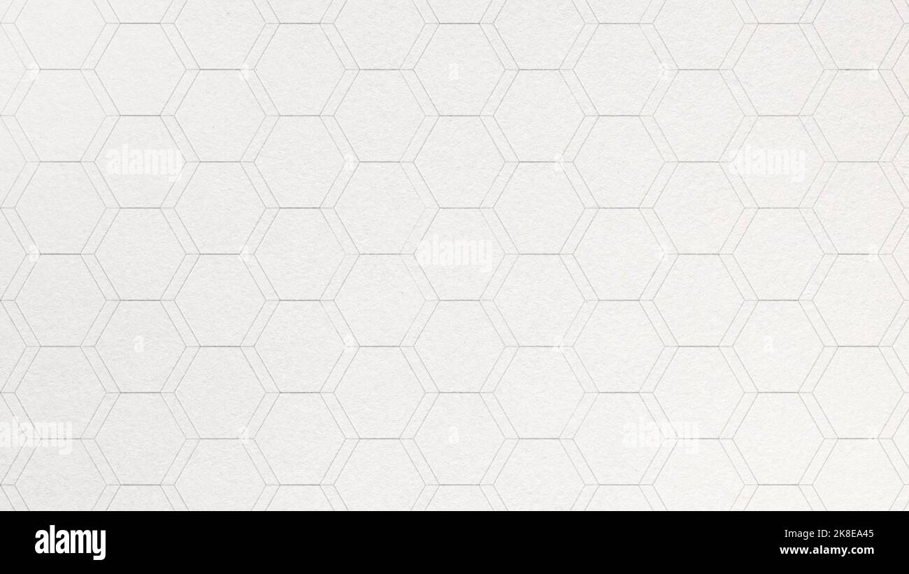 Modello esagonale o a nido d'ape su sfondo di carta ruvida. Primo piano di una carta decorativa e astratta con spazio di copia. risoluzione 4k. Foto Stock