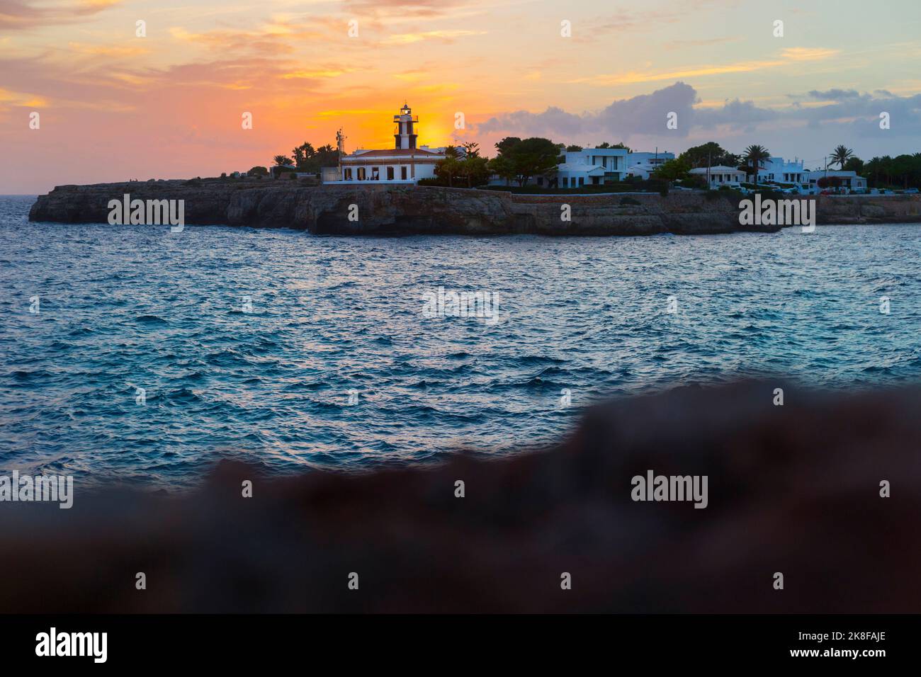 Spagna, Isole Baleari, Ciutadella de Menorca, Faro di Punta de SA Farola al tramonto Foto Stock