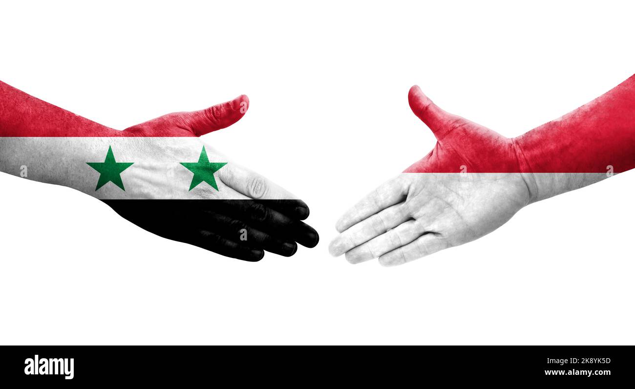 Stretta di mano tra Monaco e Siria bandiere dipinte sulle mani, immagine trasparente isolata. Foto Stock