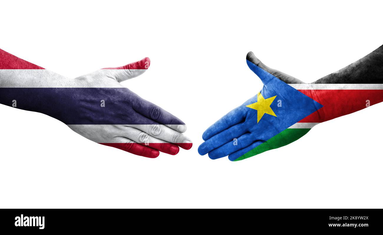 Stretta di mano tra Sud Sudan e Thailandia bandiere dipinte sulle mani, immagine trasparente isolata. Foto Stock