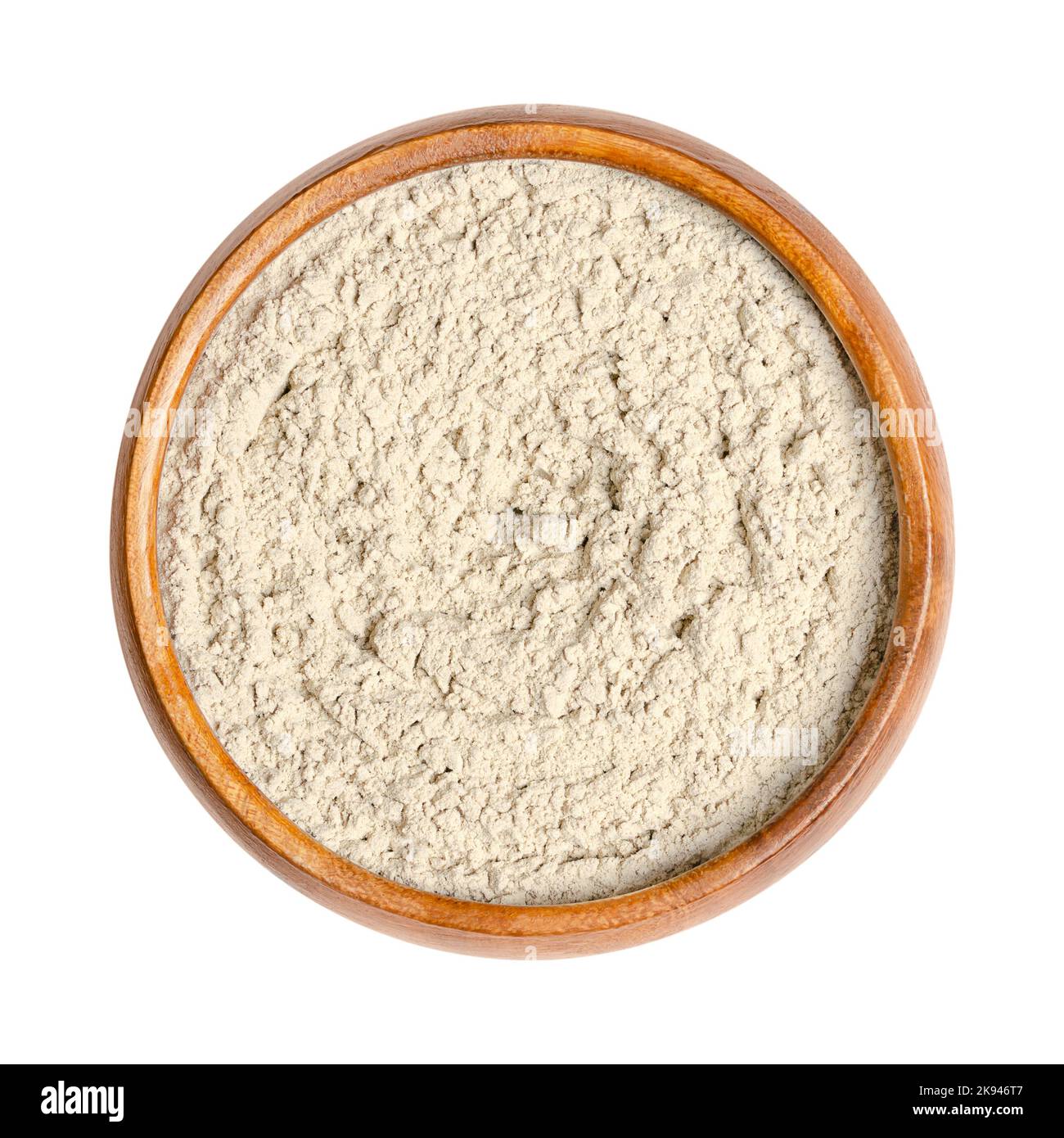 Bentonite, polvere secca di montmorillonite in una ciotola di legno. Usato nella medicina popolare come argilla medicinale. Argilla rigonfiante assorbente, ceneri vulcaniche intemperie. Foto Stock