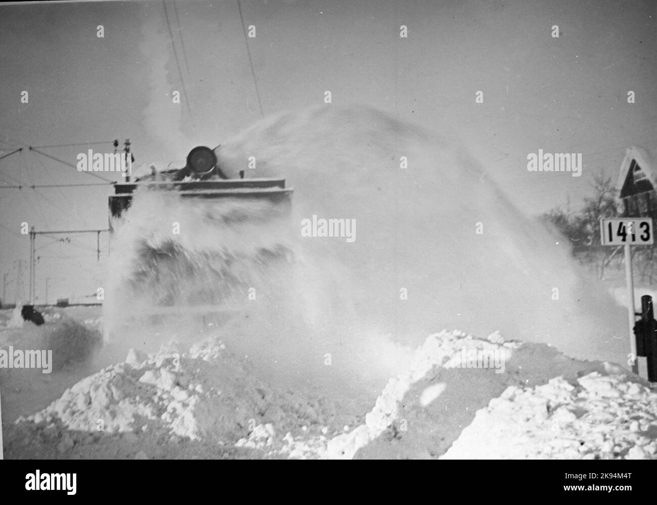 Fiocco di neve al lavoro al km 1413 Foto Stock