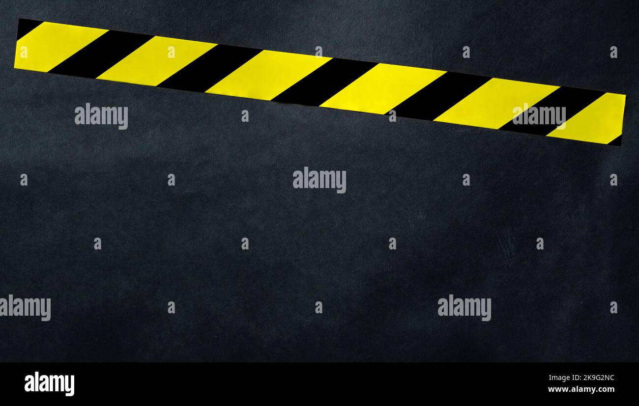 Nastro giallo con strisce nere e gialle Foto Stock