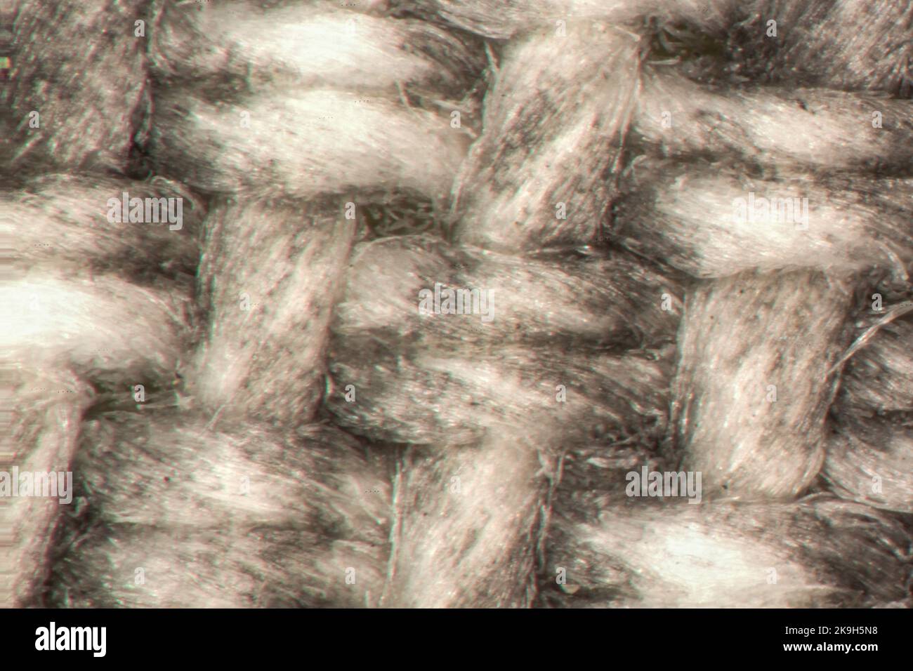 Fibre intrecciate in un tessuto colorato Foto Stock