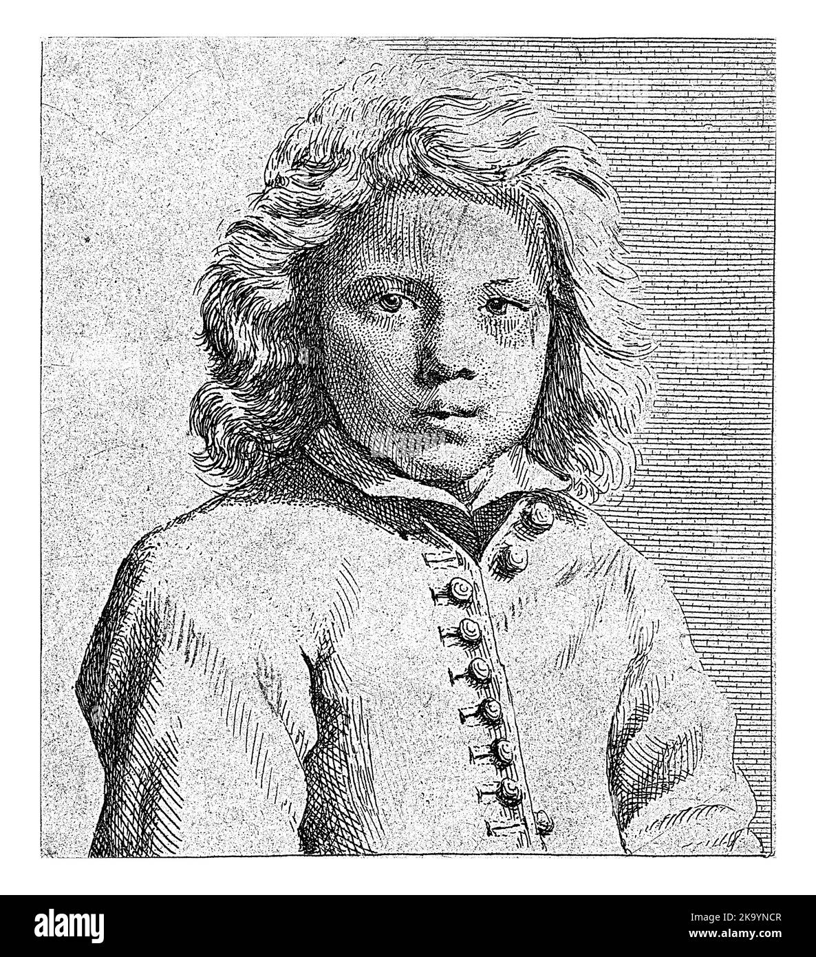 Ritratto di un ragazzo con i capelli ondulati della spalla. Indossa una giacca con bottoni. Foto Stock