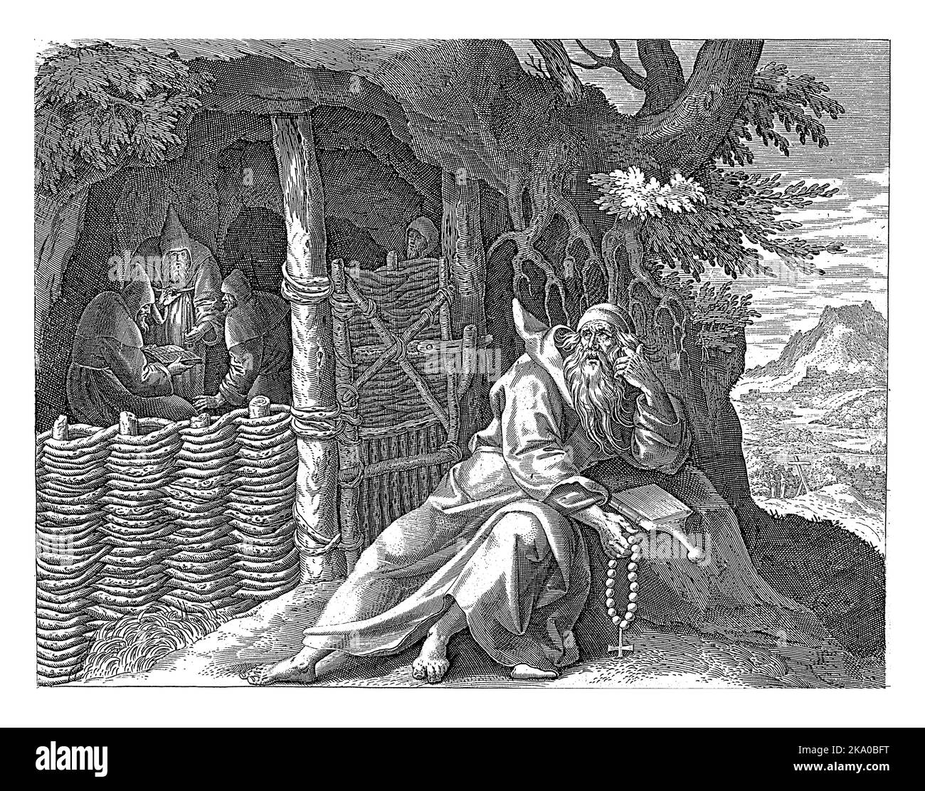 Il San Spiridon di Cipro di fronte a una grotta nel deserto. Sta mentendo contro una roccia e sta leggendo una bibbia. Nella grotta, tre monaci stanno leggendo fr Foto Stock