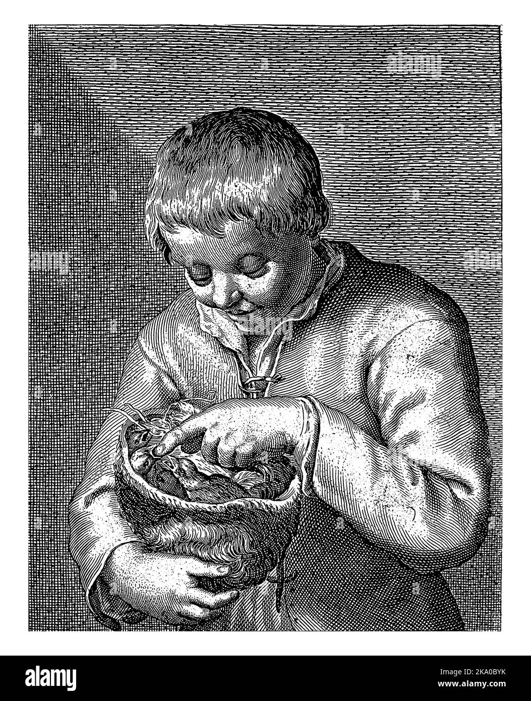 Un ragazzo si piega sopra il cappello in cui un uccello ha costruito il suo nido. Con didascalia olandese a due righe. Foto Stock