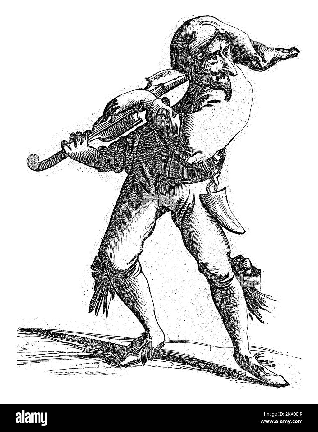 Una figura simile a un giester con un naso grande strimpiglia le corde di un violino. Indossa pantaloncini con grandi archi e ha un cappello sulla testa. Foto Stock