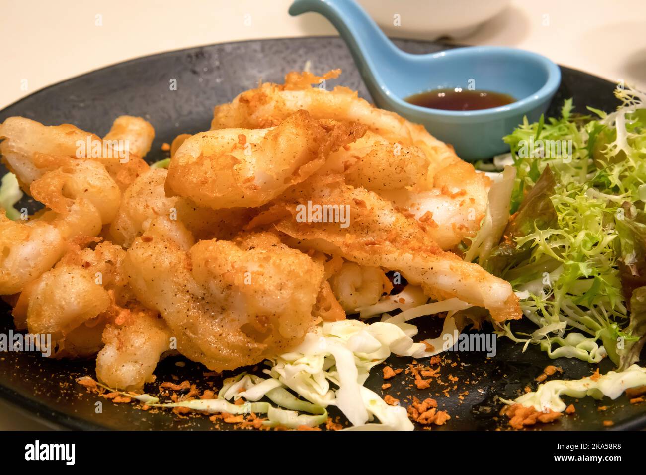 Calamari fritti cinesi in pastella, Hong Kong, Cina. Foto Stock
