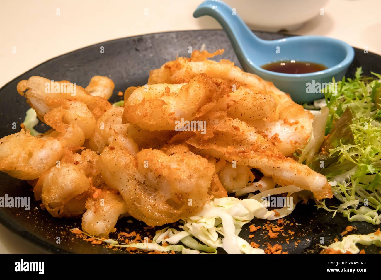 Calamari fritti cinesi in pastella, Hong Kong, Cina. Foto Stock