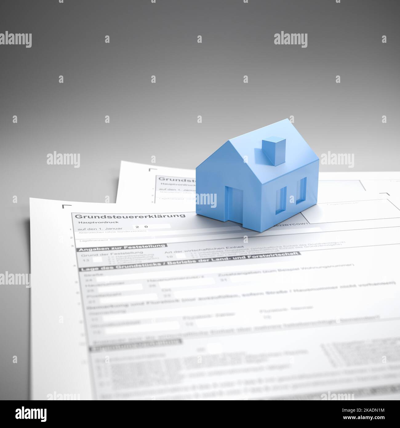 Concetto tedesco di imposta sulla proprietà ('Grundsteuer'). Una casa sul formulario per la dichiarazione della tassa. Foto Stock