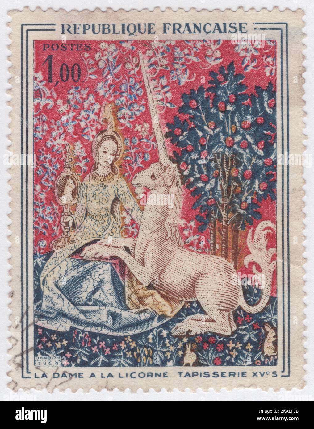FRANCIA - 1964 ottobre 31: Francobollo multicolore da 1 franchi raffigurante un frammento, tratto dall'arazzo la Dame a la licorne (la Signora e l'Unicorno), circa 1500. Museo di Cluny, Parigi. Arte della Chiesa Foto Stock