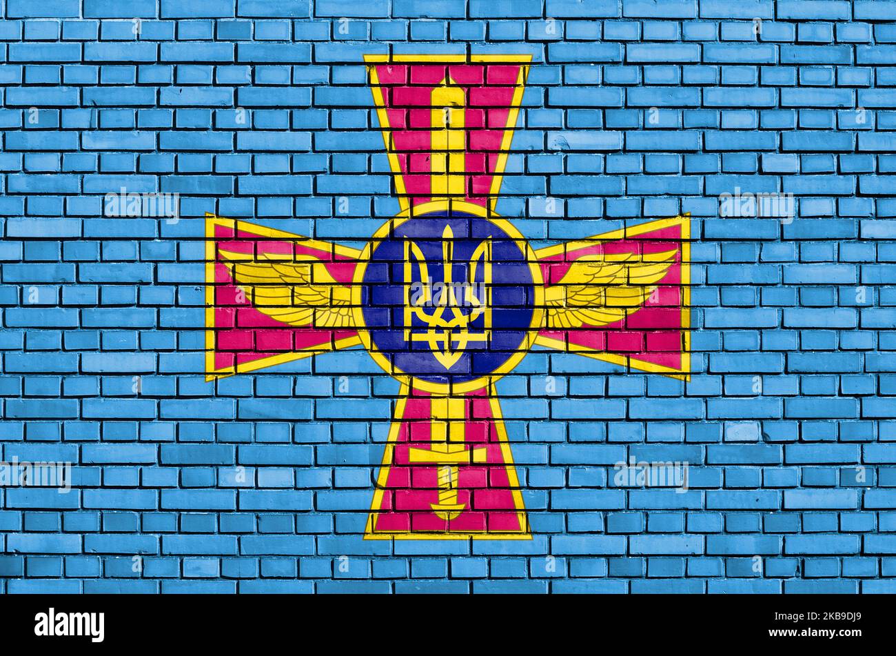 Bandiera dell'aeronautica Ucraina dipinta su muro di mattoni Foto Stock