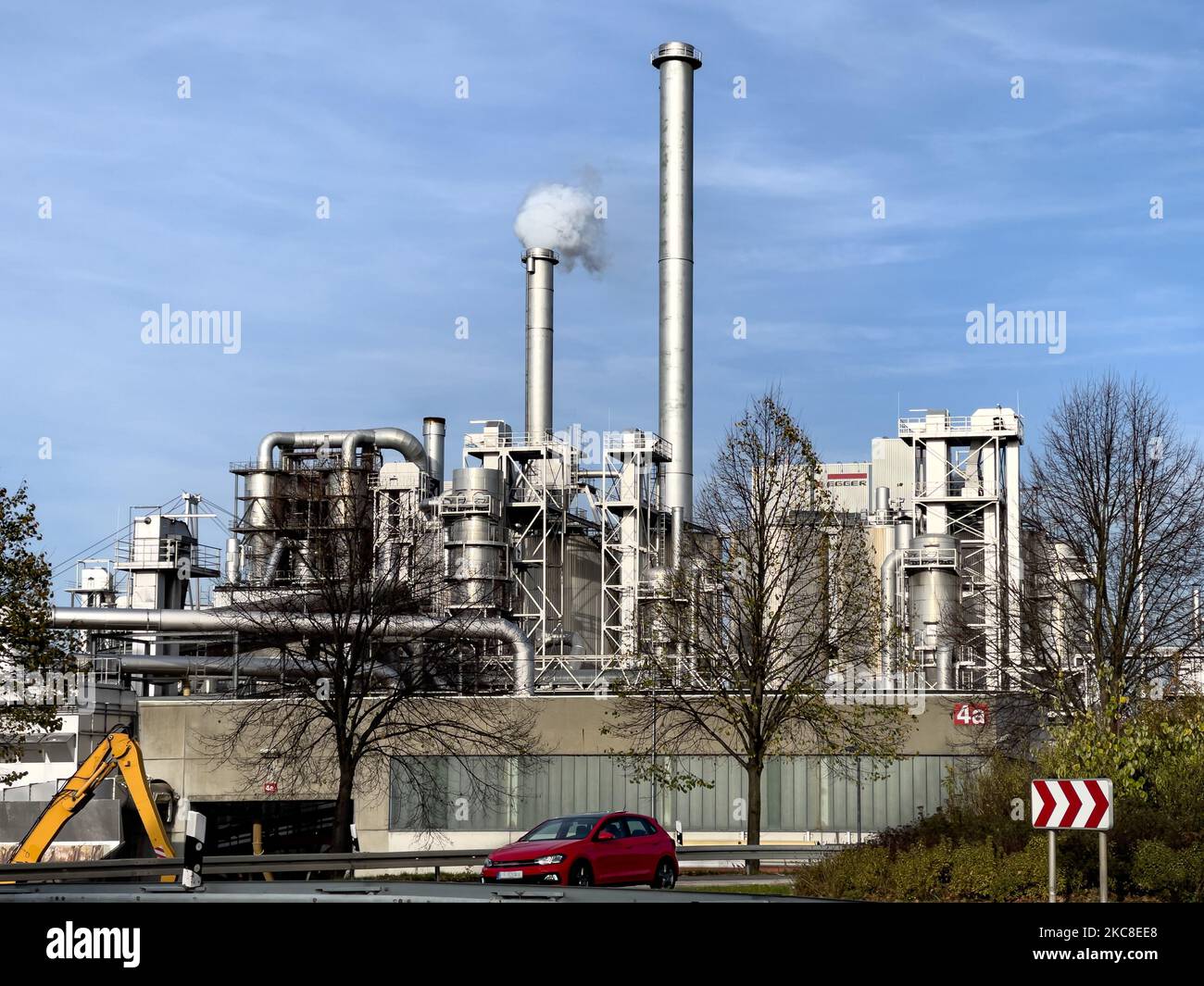 A Wood Processing plant with smoke streaming out of the pipe in Brilon, Germany Foto Stock