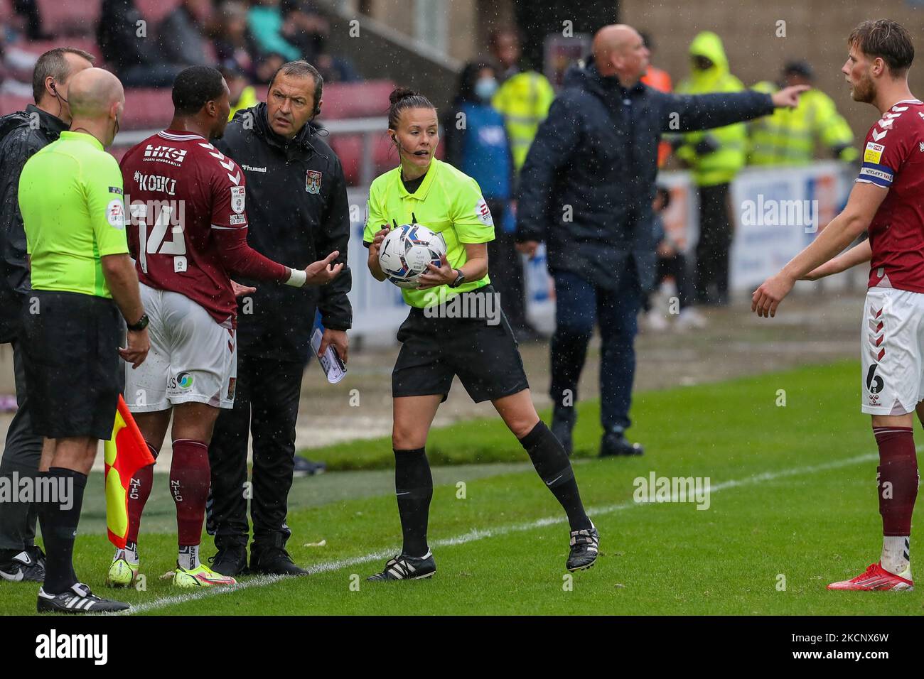 L'arbitro Rebecca Welch prende il pallone da Ali Koiki di Northampton Town durante la seconda metà della partita della Sky Bet League Two tra Northampton Town e Sutton United al PTS Academy Stadium di Northampton sabato 2nd ottobre 2021. (Foto di John Cripps/MI News/NurPhoto) Foto Stock