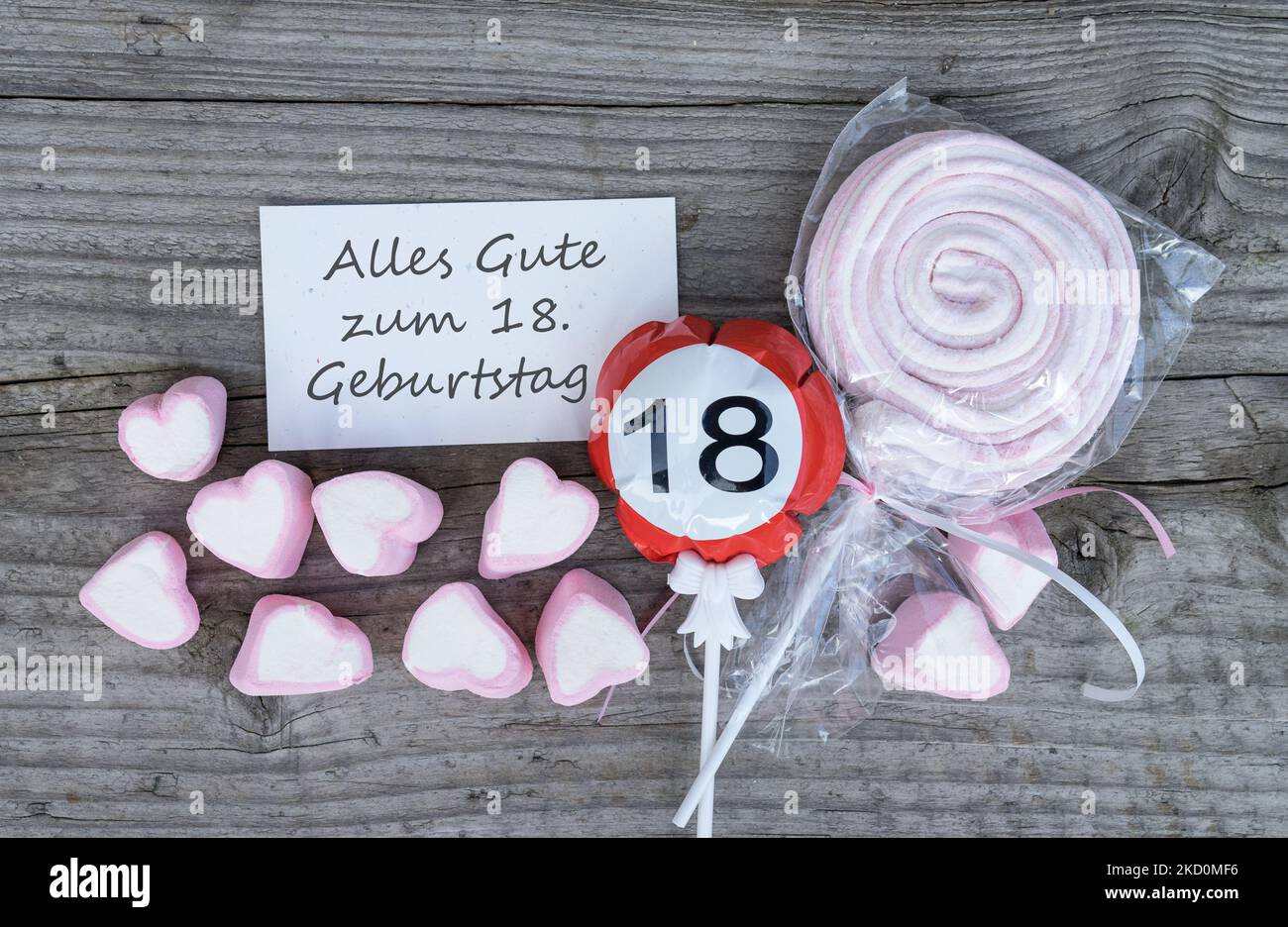 Biglietto d'auguri tedesco con testo: Buon compleanno 18th e marshmallow rosa Foto Stock