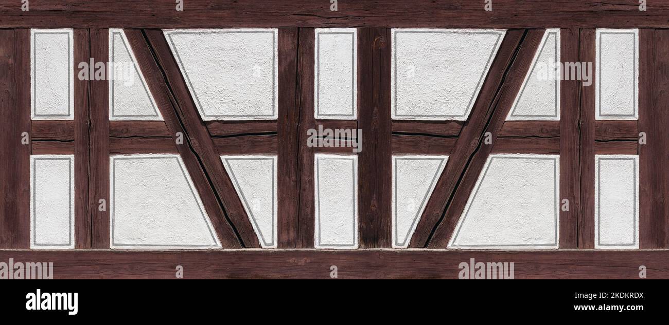 Dettaglio a graticcio - travi in legno marrone e spazi intonacati bianchi Foto Stock