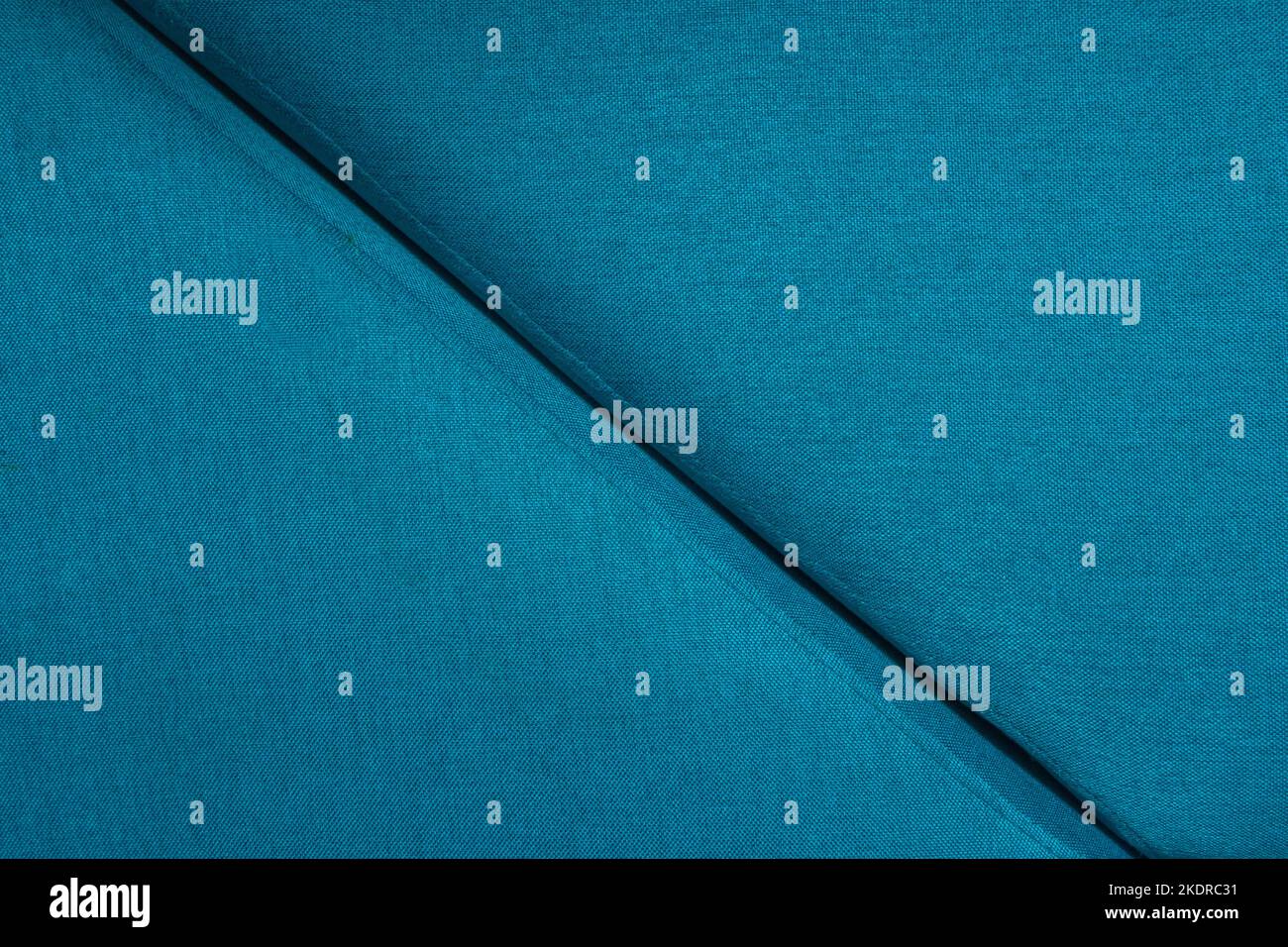 Linea dettaglio oggetto design elemento bordo parte divano primo piano materiale blu. Foto Stock