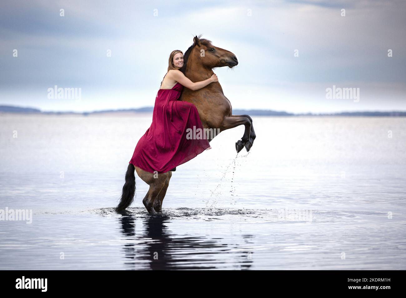 Donna con pony Foto Stock