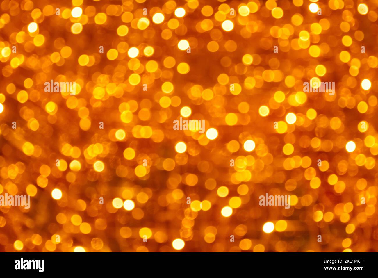 Natale oro sfocato bokeh. Brillano e brillano di colore dorato. Vuoto per il progetto. Concetto di vacanza con posto per il testo. Foto Stock