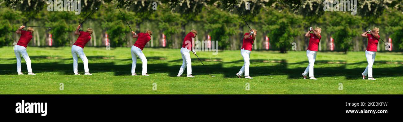 Braunschweig, Germania, 18 maggio 2019: Colpo continuo del tee off al golf, signora anziana in pantaloni bianchi e camicia rossa colpisce la sfera di golf sopra il verde, co Foto Stock