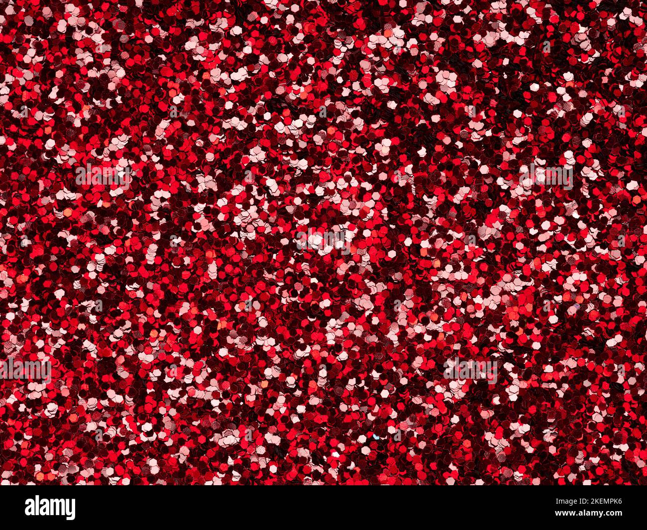 Glitter rosso. Perfetto sfondo olografico o motivo di scintillante brillantezza per la decorazione e il design di Natale, Capodanno, San Valentino Foto Stock