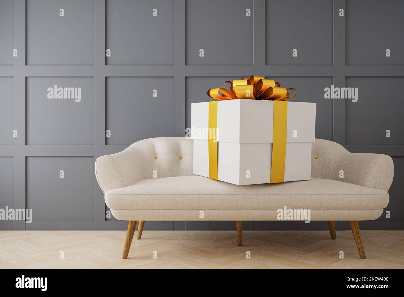 Una grande scatola regalo su un divano. Concetto per dare eccessivo. Foto Stock