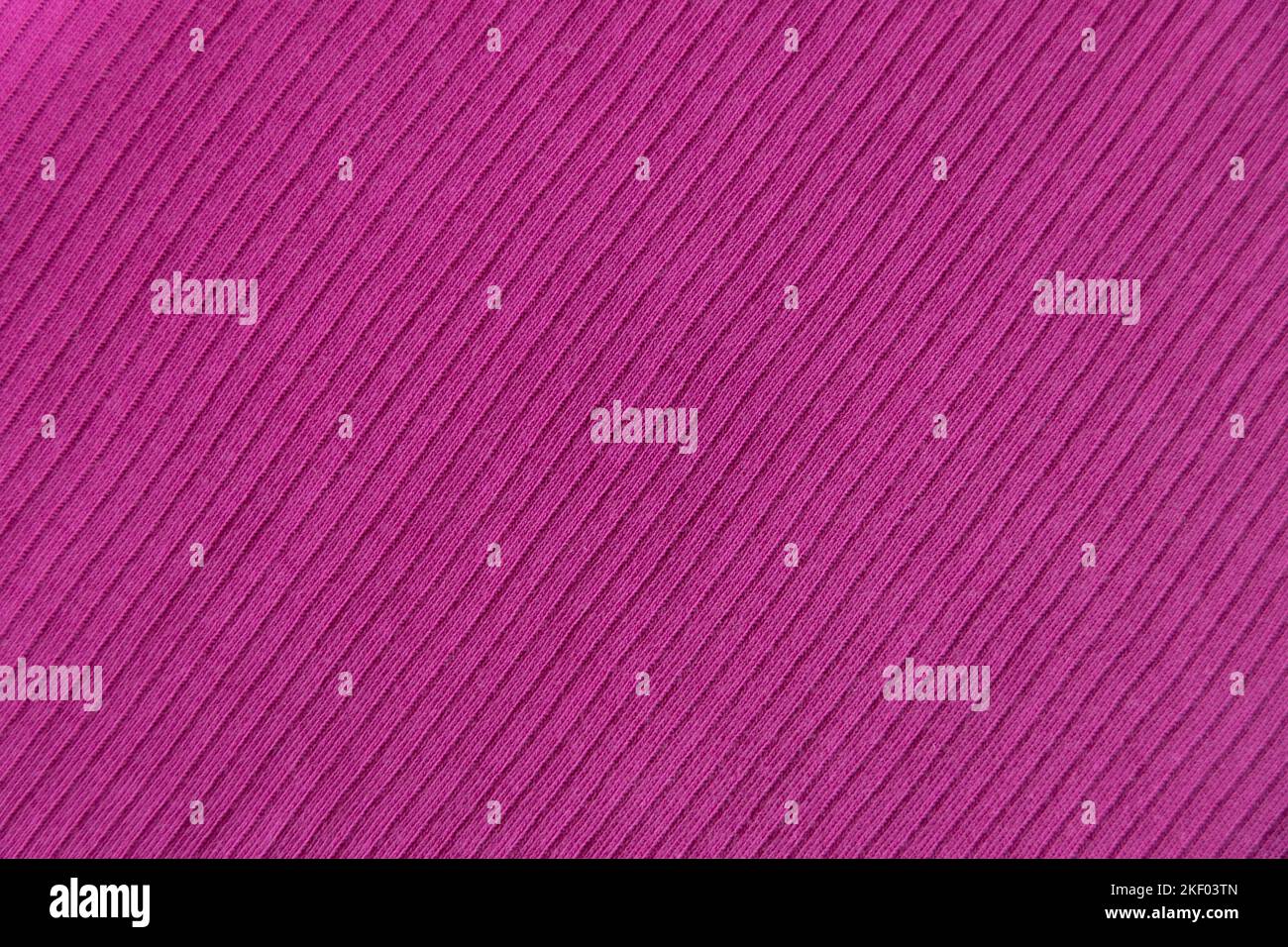 Tessuto di cotone a coste tessuto colore rosa, fucsia . Primo piano costola di cotone tessuto e modello tessile. Tessuti naturali organici sfondo texture. Foto Stock
