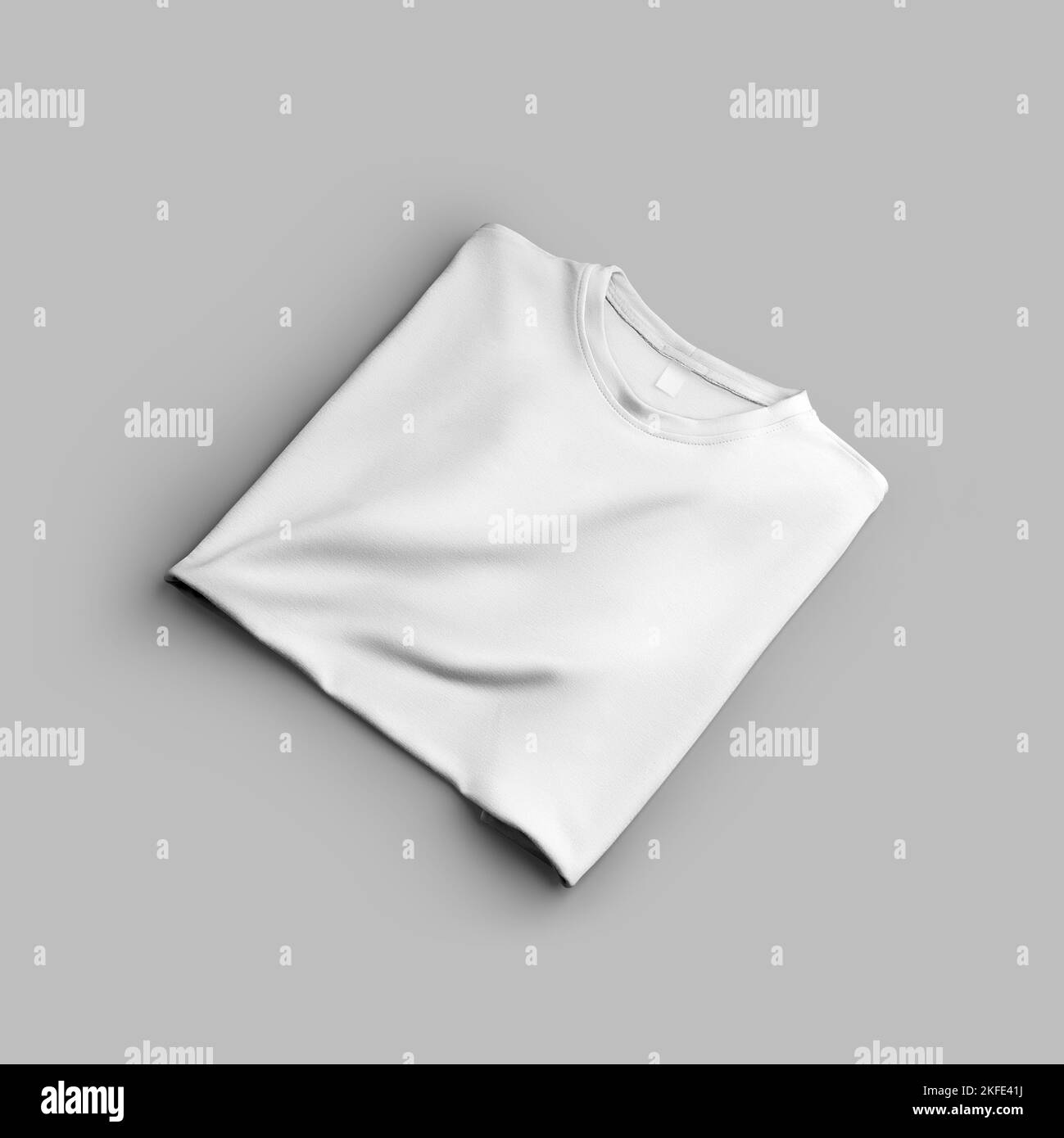 T-shirt bianca oversize mockup, ripiegata, con spazio per design, motivo, vista frontale, isolata sullo sfondo. Primo piano modello di abbigliamento di moda per gli adoratori Foto Stock