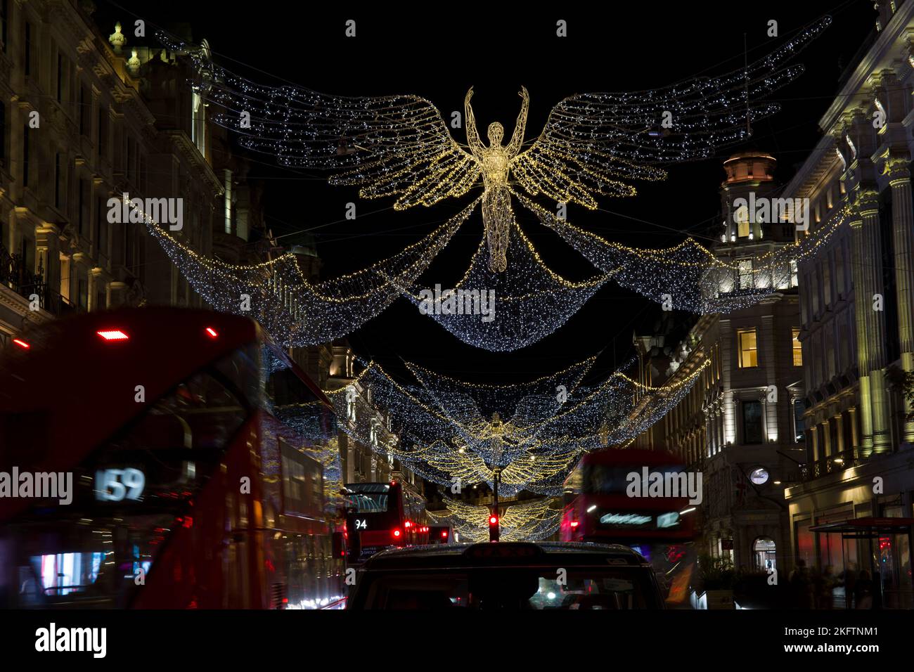 Luci di Natale illuminazioni Angeli Regent Street West End Londra Foto Stock