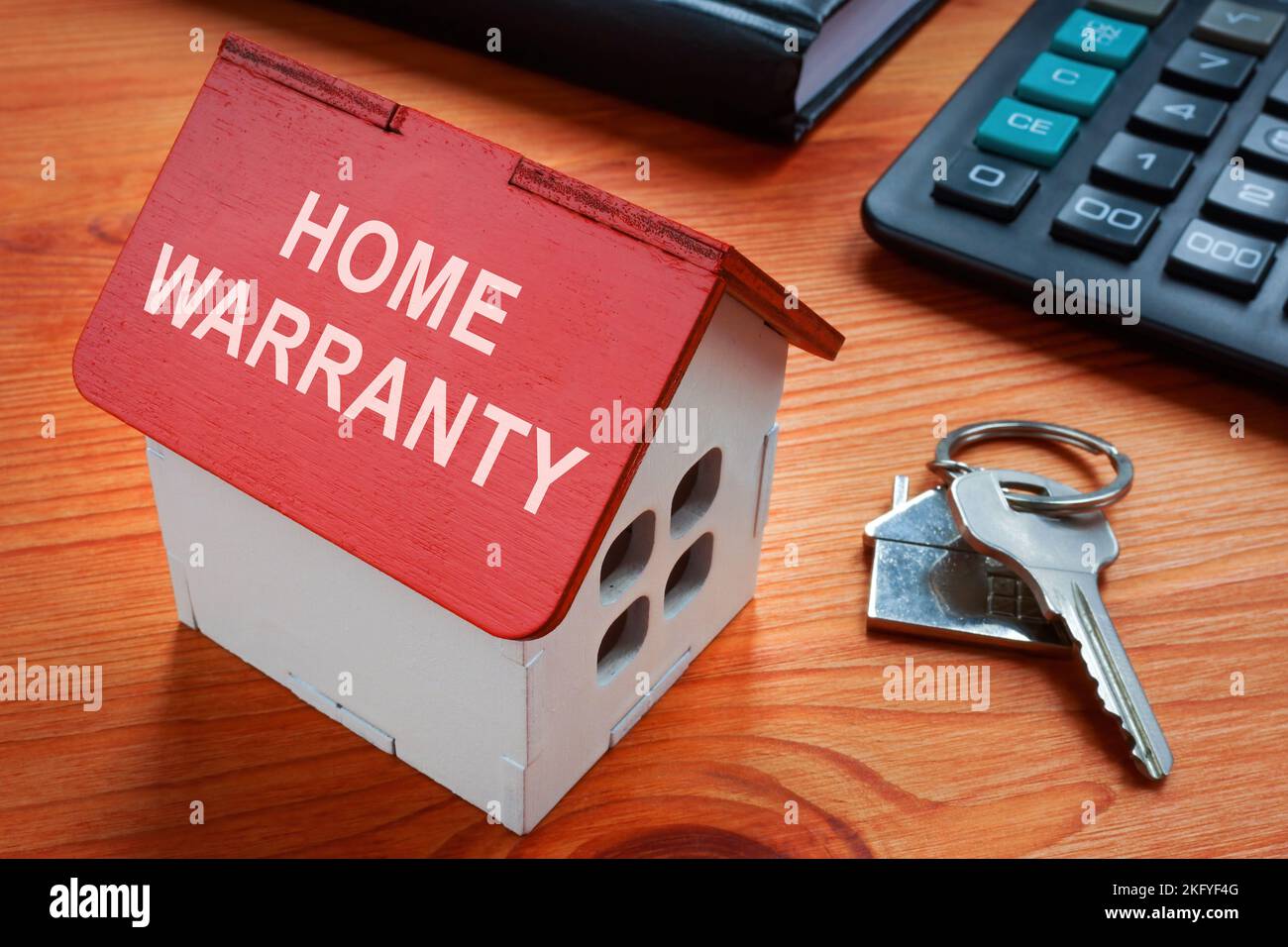 Modello di casa con iscrizione garanzia Home. Foto Stock