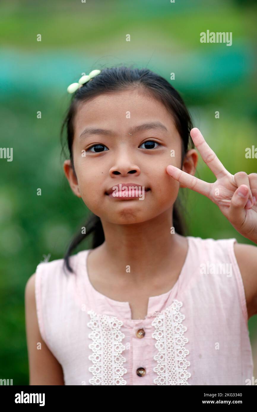 Ritratto di una giovane ragazza vietnamita sorridente. Hoi An. Vietnam. Foto Stock