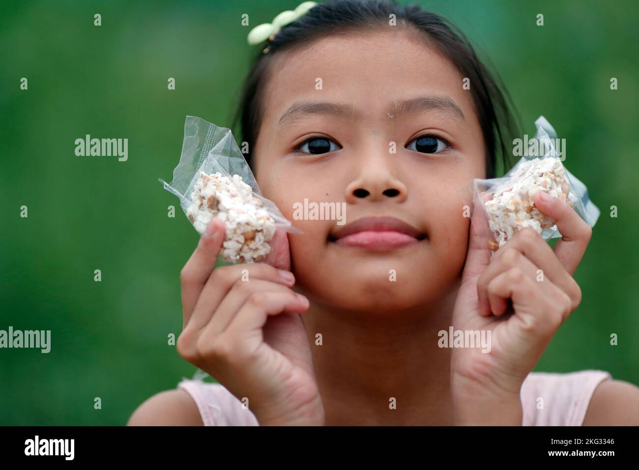 Ritratto di una giovane ragazza vietnamita sorridente. Hoi An. Vietnam. Foto Stock