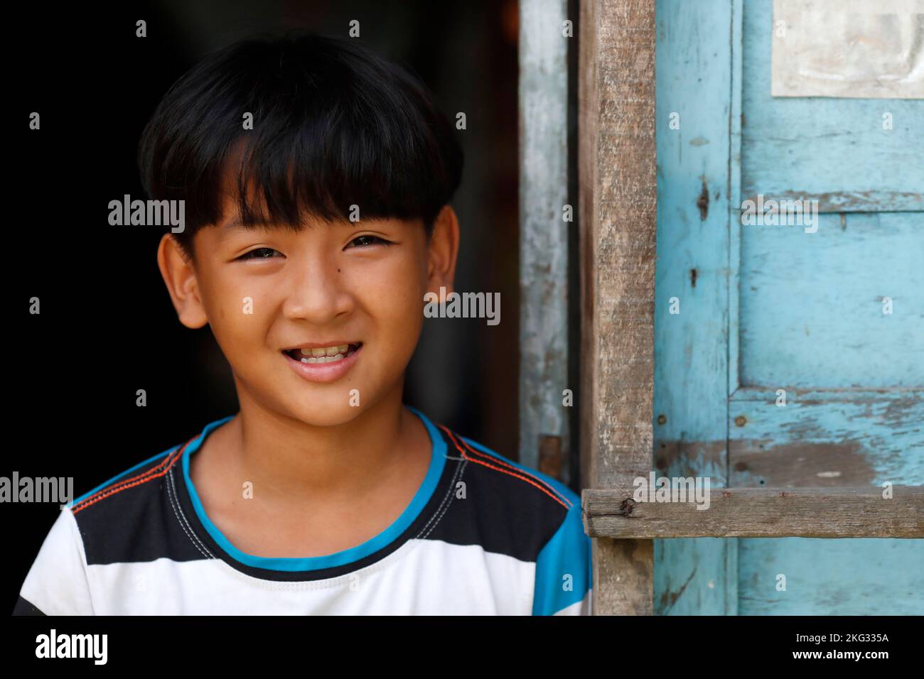 Ritratto di un giovane ragazzo vietnamita sorridente. Tan Chau. Vietnam. Foto Stock