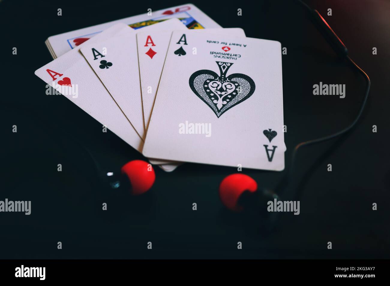 4 carte Asso con un auricolare Foto Stock