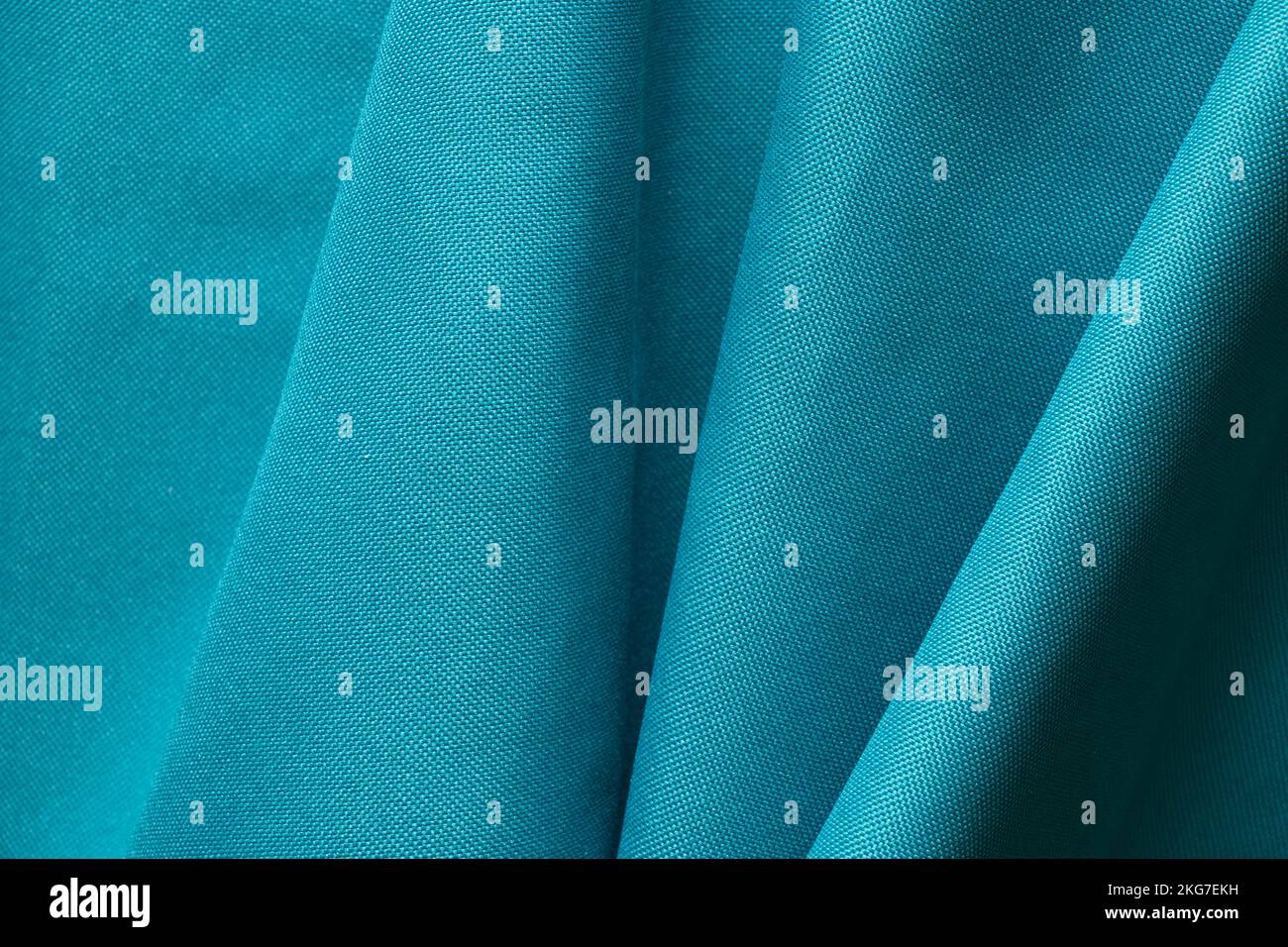 Tessuto grinzito verde per lo sfondo, tessuto per la foto macro di sfondo Foto Stock