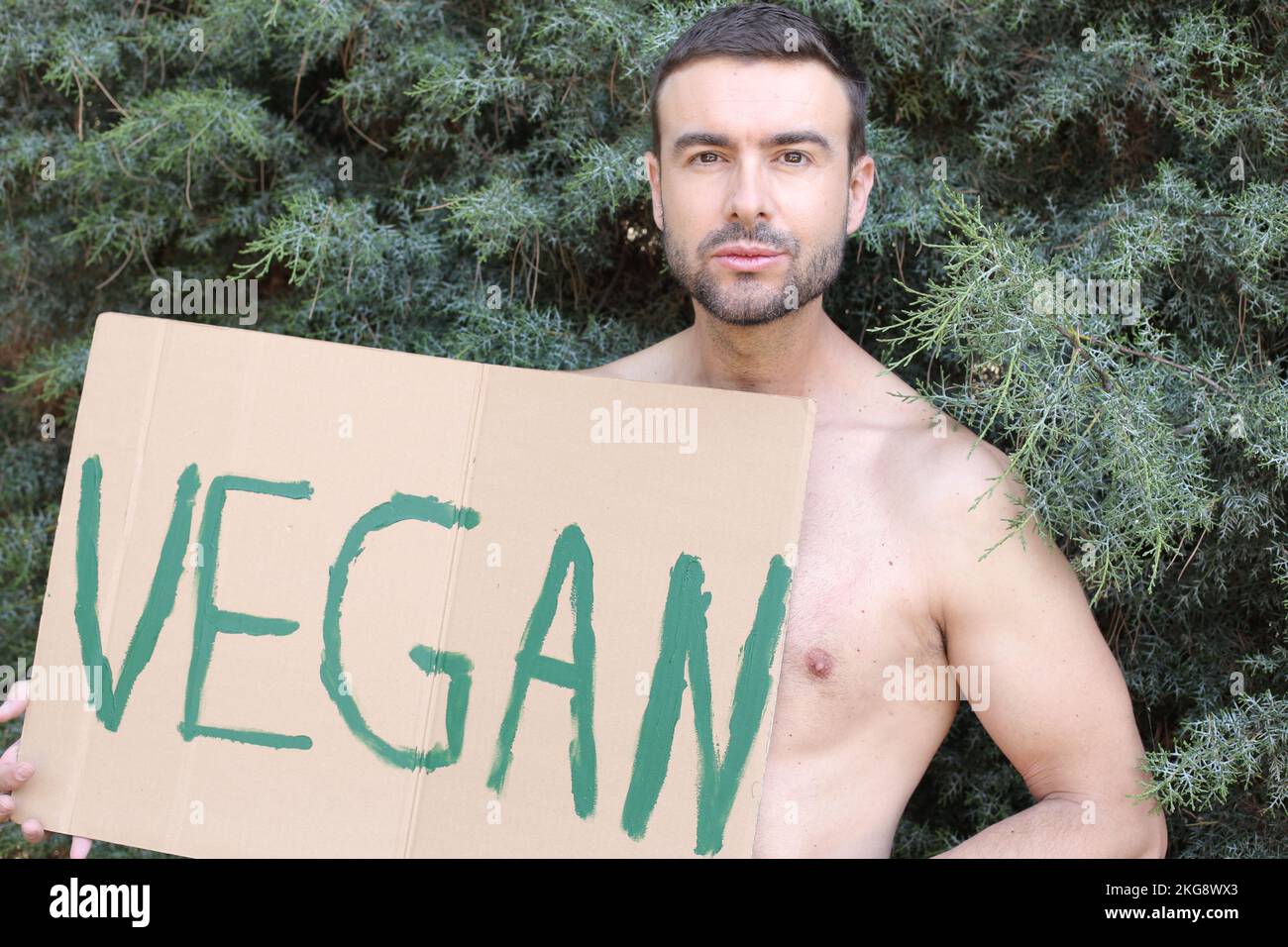 Attivista vegano con un cartello Foto Stock