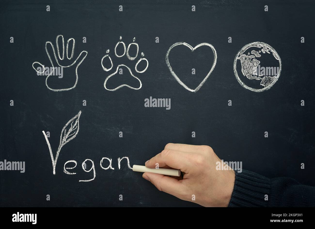 Disegno uomo vegan concetto sulla lavagna, close-up Foto Stock