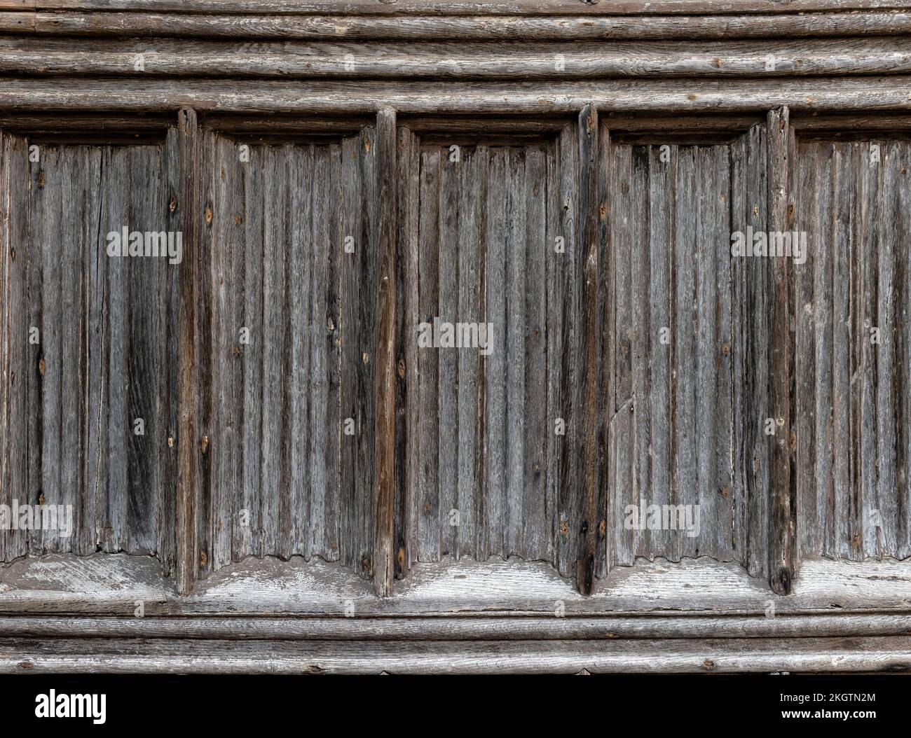 Texture di fondo di vecchia porta in pannelli di legno sbiadito Foto Stock