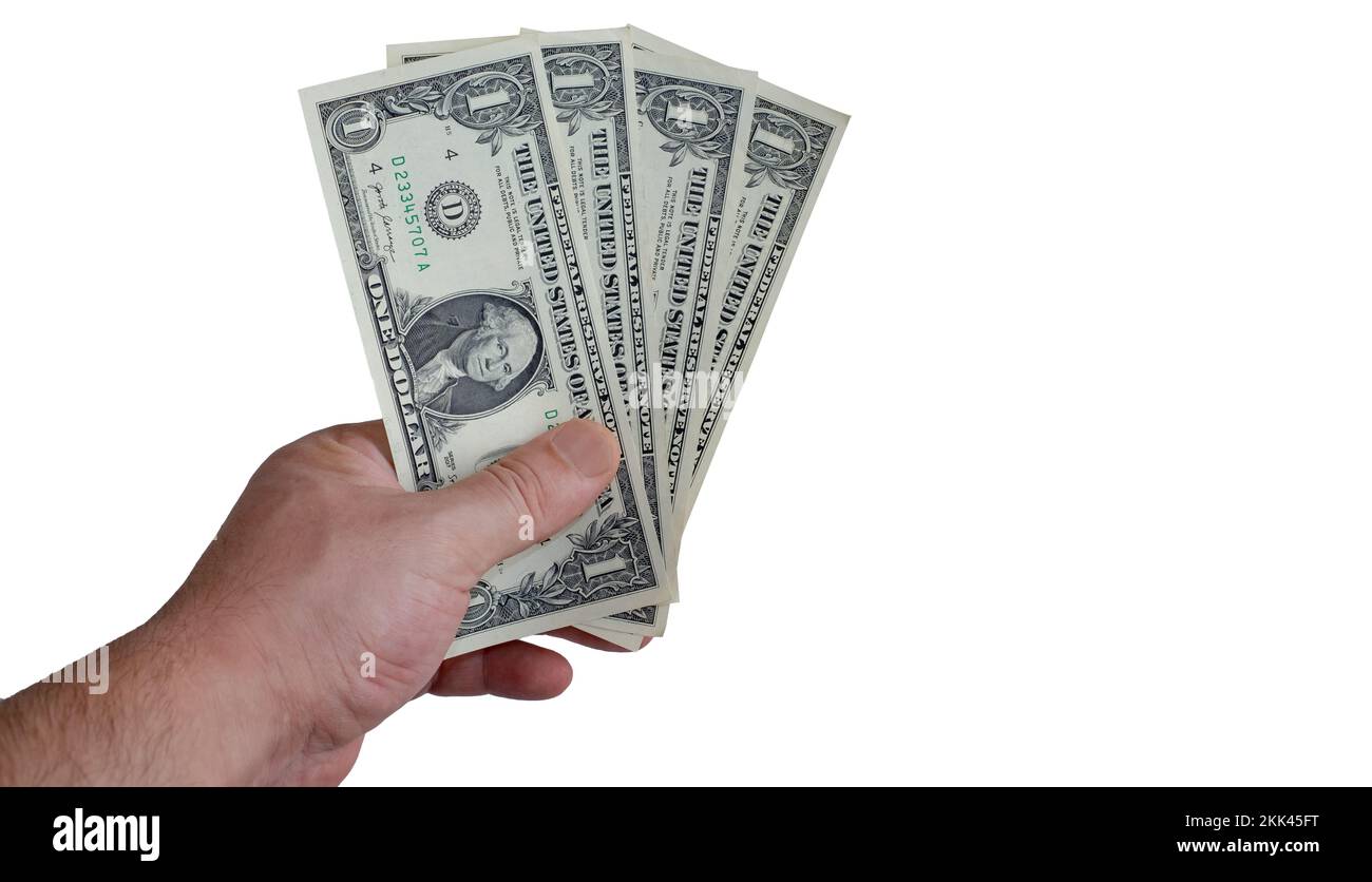 La mano che tiene le fatture del un-dollaro. vista dall'alto, mano maschile che tiene dollari su sfondo bianco. Copia spazi. Foto Stock