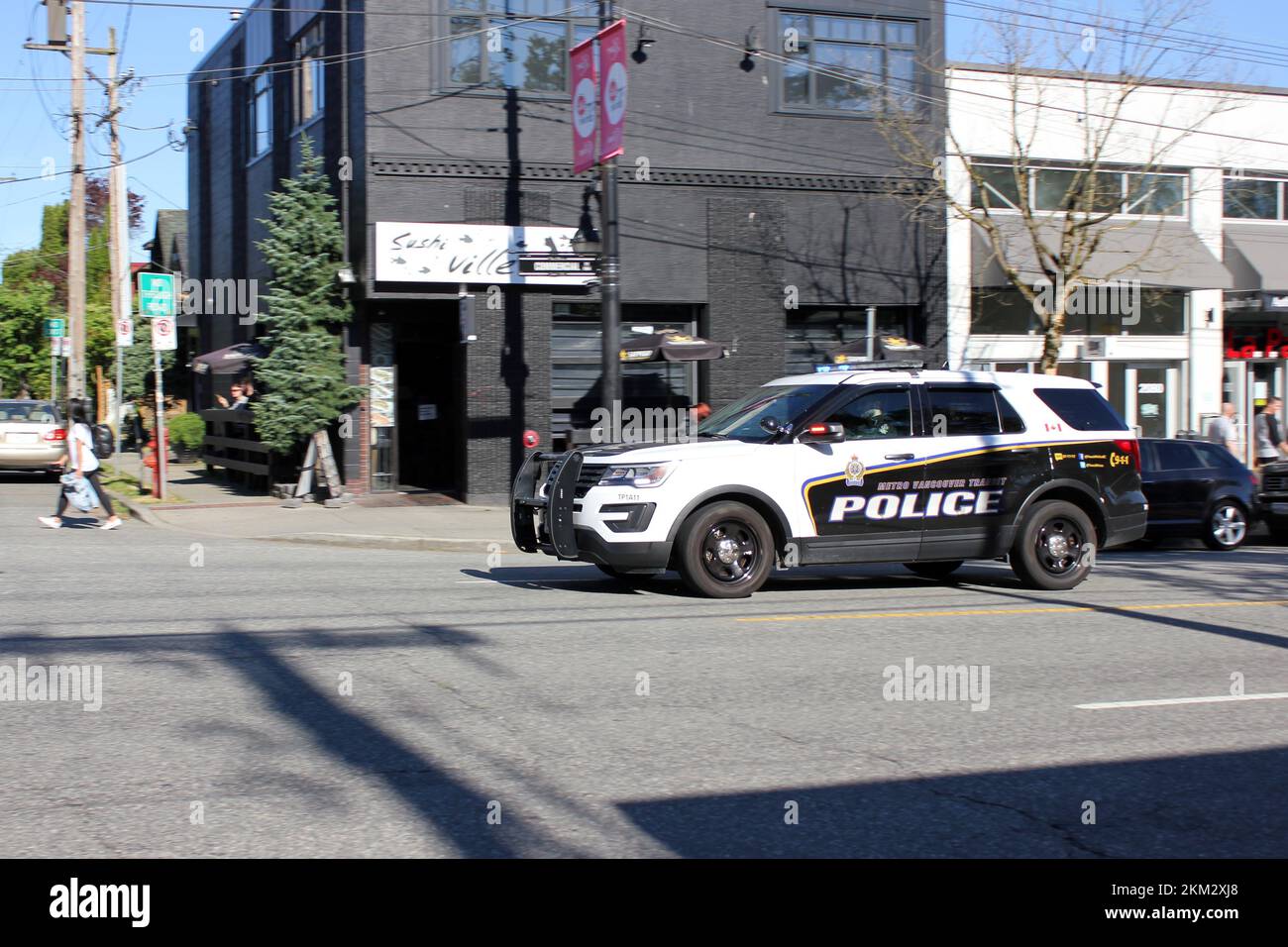 Una macchina di polizia a Commercial Drive Foto Stock