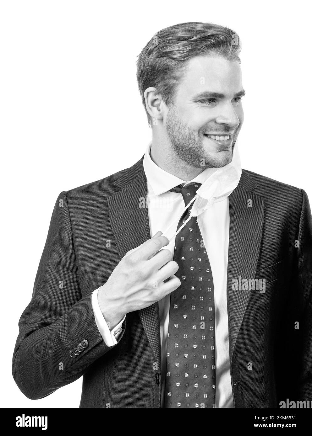 Im non ha paura. L'uomo felice take off maschera. Uomo professionale sorriso in abbigliamento formale. Sorridente avvocato Foto Stock