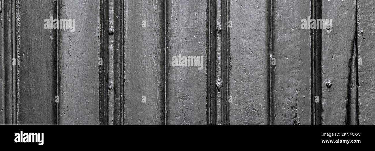 Trama di fondo di vecchio porte in legno sbiadito in formato panorama Foto Stock