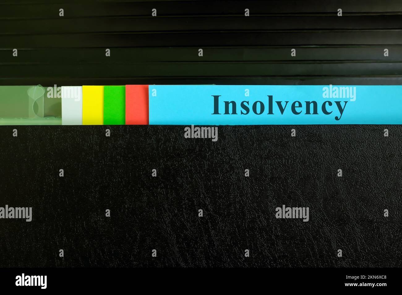 File di insolvenza nella cartella Binder nera. Concetto finanziario e commerciale di insolvenza. Foto Stock