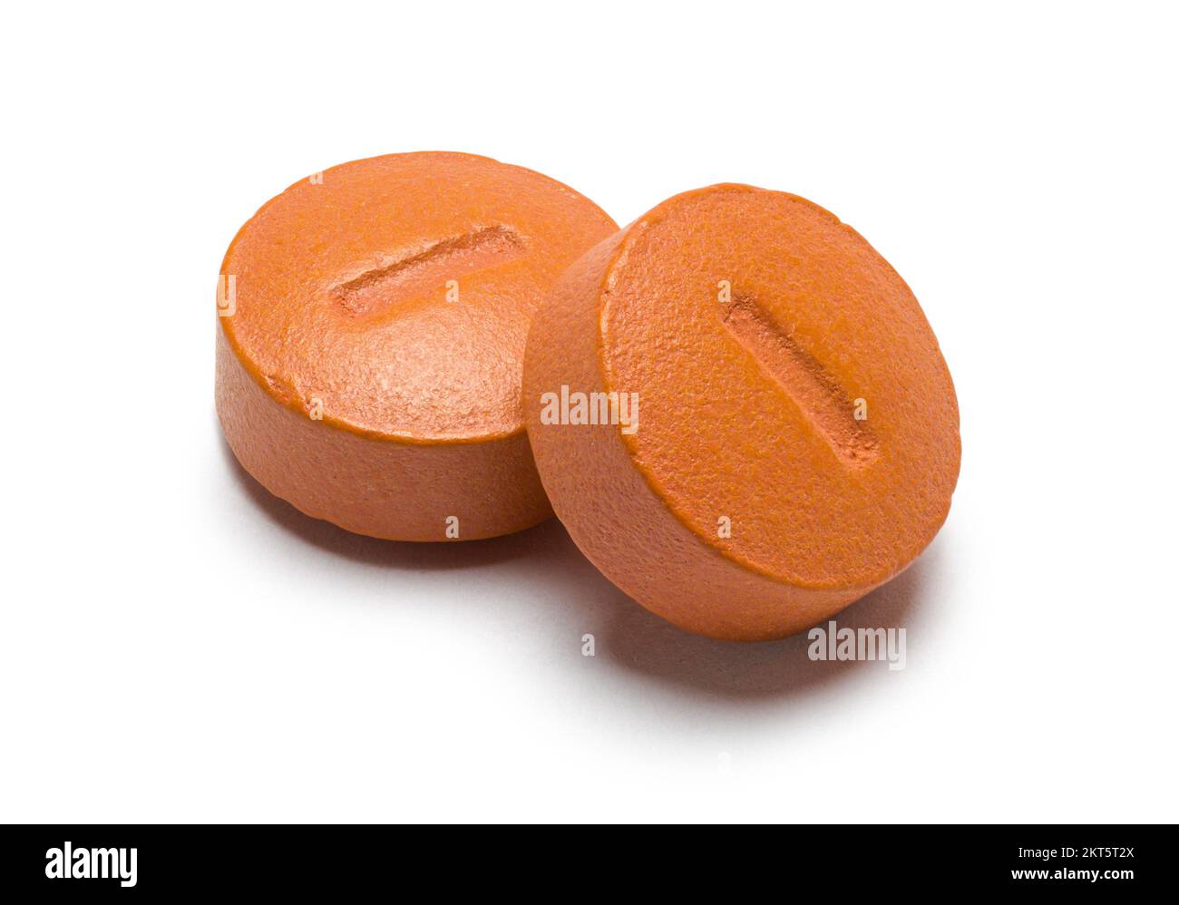 Due Orange Round pills Cut out on White. Foto Stock