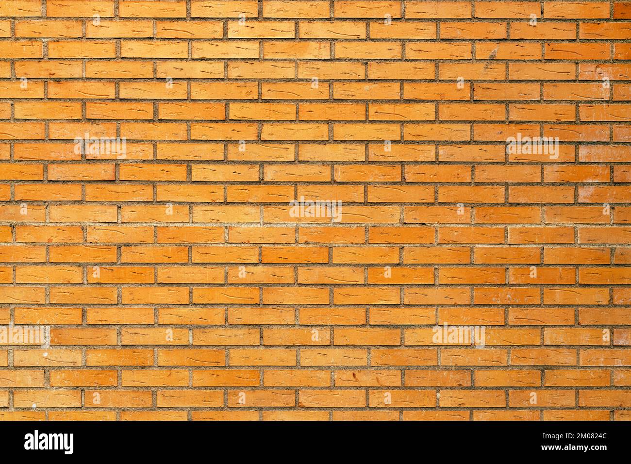 Struttura della parete in mattoni di clinker giallo, dettaglio dalle strade di Halmstad in Svezia Foto Stock