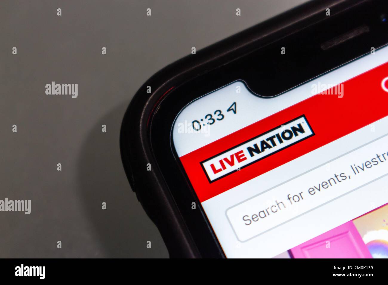 Logo di Live Nation Entertainment, Inc in iPhone. Live Nation è un'azienda statunitense di intrattenimento a livello mondiale dopo la fusione di Live Nation & Ticketmaster Foto Stock